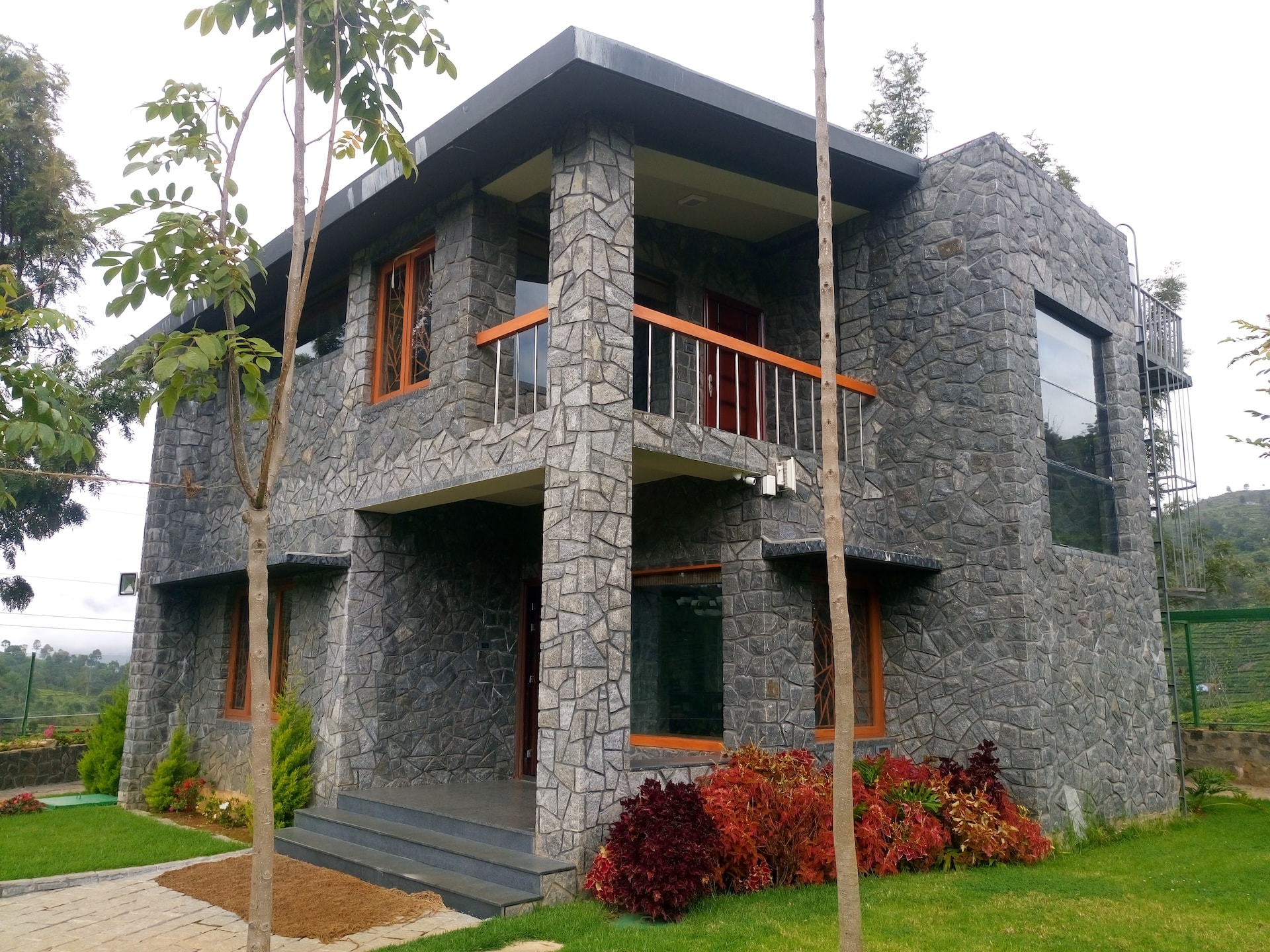 Hospitality building with lush lawn and palm trees